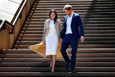 Harry and pregnant Meghan get baby gifts, meet koalas Down Under