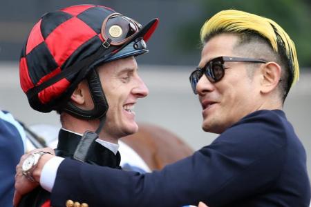 Jockey Zac Purton and singer-dancer-actor Aaron Kwok celebrate Dancing Fighter’s debut victory at Sha Tin on Saturday. 