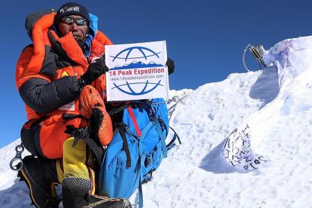 Sherpa celebrates world-record Everest climbs... by doing it again