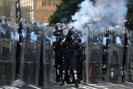 HK cops fire rubber bullets as protests turn violent