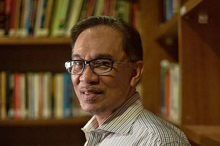 Writer who wrote book on Anwar says he did blackmail PKR chief  