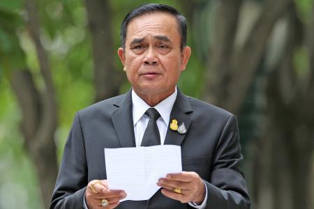 Thai leader orders end to military rule but keeps some junta powers