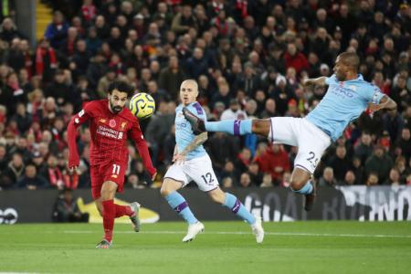 Liverpool go eight points clear with 3-1 win over Man City
