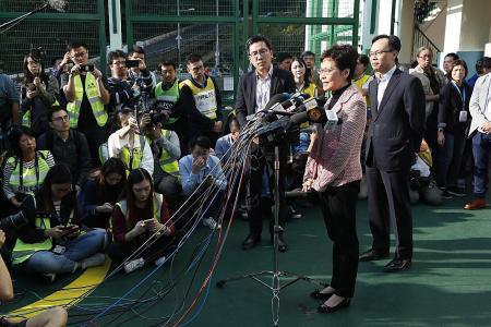 HK&#039;s Lam vows to &#039;listen humbly&#039; to voters after pro-democracy win