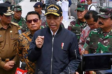 Indonesian President visits island in waters disputed by China
