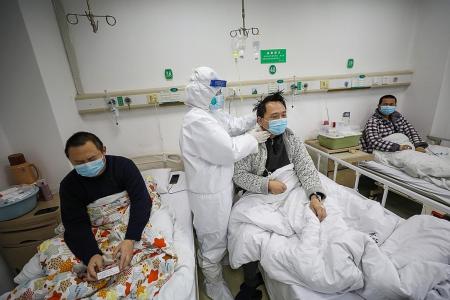 China records largest number of infections; Japan reports first death