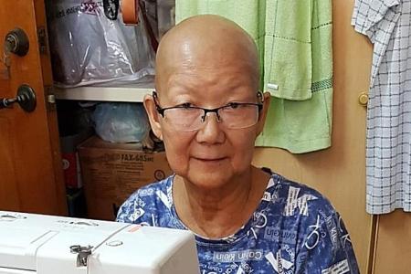 Showing grit, two elderly volunteers sew masks for those in need