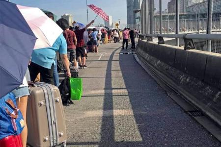 Malaysians rush home before new quarantine rule kicks in 