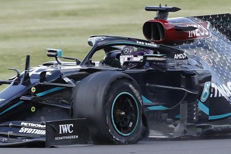 Lucky Lewis Hamilton limps to victory on three tyres