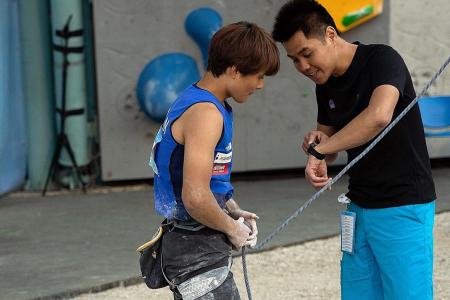 Singaporean official Stanley Yeo scales the summit of sport climbing