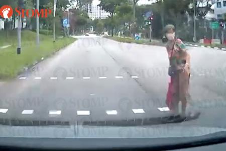 Old lady 'pops out of nowhere' and almost gets hit by car at Bukit Panjang junction