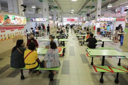 Buzz returns to hawker centres, coffee shops as curbs ease