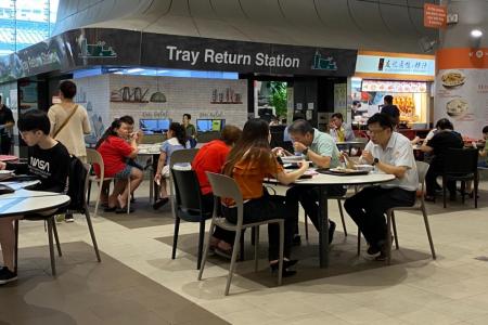 Buzz returns to hawker centres, coffee shops as curbs ease