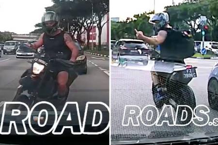 Motorcyclist flashes middle finger at driver despite his own reckless behaviour