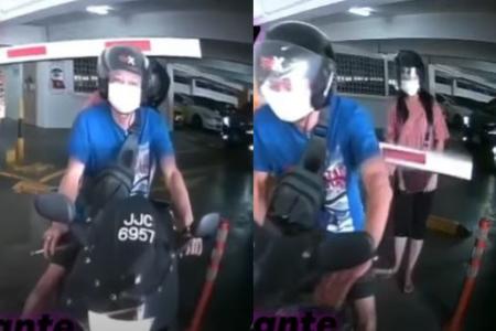 Biker tries to sneak out of carpark and barrier smacks pillion rider