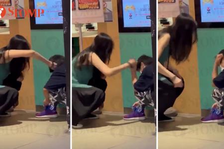 Woman yells at boy, twists his ear in public for not knowing how to tie shoelaces