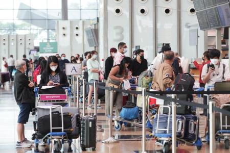 Queues, crowds at Changi Airport on first day of relaxed travel measures