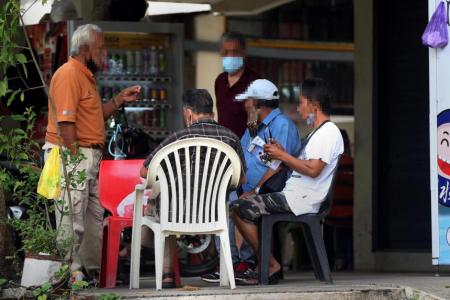 Big groups gather at HDB void decks, coffee shops for illegal betting on horse races