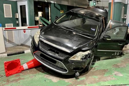 Car tries to force its way into Singapore at checkpoint, three arrested