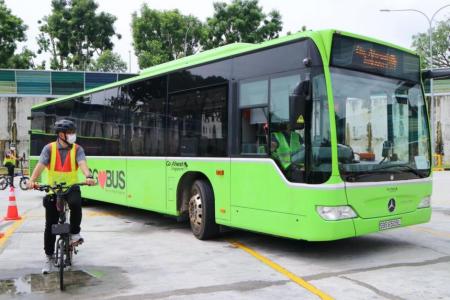 Cyclists, bus drivers swop roles to learn about each other's road safety challenges