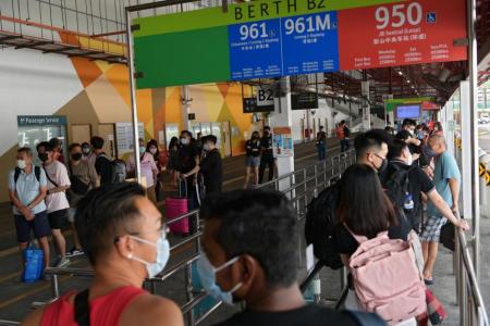 Public bus services to Johor resume, attracting day trippers and Malaysians going home