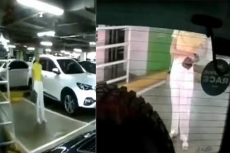 Woman tries to 'chope' MBS parking space, but driver just reverses in anyway