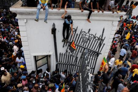 Protesters storm government buildings in Colombo, President Rajapaksa flees