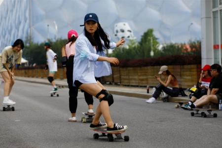 Beijing women ride Covid wave on skateboards