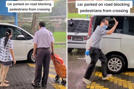 MPV blocks sheltered walkway on rainy day