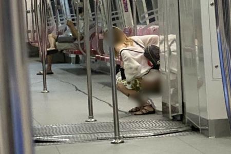 Woman stuns MRT commuters when she yanks down shorts and urinates in cabin