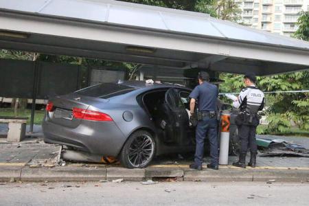 Car crashes into bus stop, driver missing when police arrive