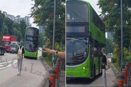 Afraid he'll miss his bus again, man stands in middle of bay along AYE