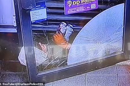UK shopkeeper traps knife-wielding robber until cops arrive