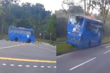 Malaysia bus beats red light, mounts kerb along Woodlands Ave 12