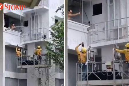 Resident uses pole to stop workers on gondola from moving up