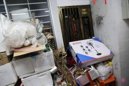 Hougang hoarder climbs through window to get into flat