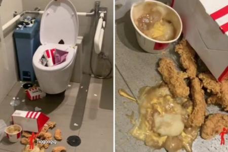 Finger-lickin' bad: Someone leaves mess of KFC food in handicap restroom