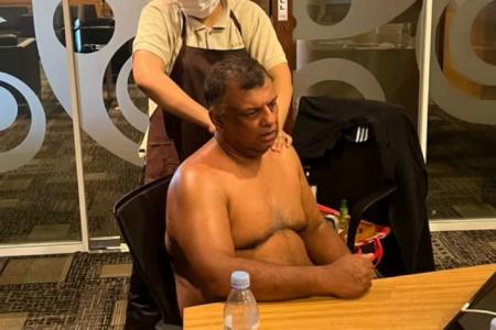 AirAsia boss Tony Fernandes draws flak for shirtless massage during conference call