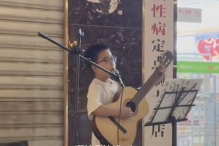 China boy caught vandalising made to busk for restitution