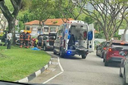 Motorcyclist trapped under car cut free after accident near Istana