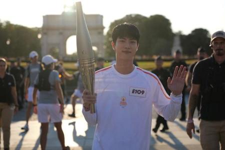 BTS singer Jin takes part in Paris Olympics torch relay