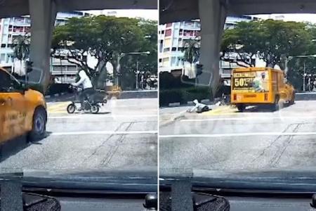 E-bike rider going against red light sent flying after getting hit by truck