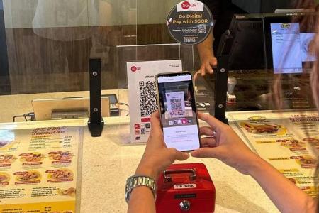 Selected merchants can access multiple QR code payment schemes with one sign-up under MAS trial