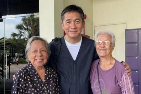 Hong Kong star Tony Leung poses with elderly fans at Gardens by the Bay