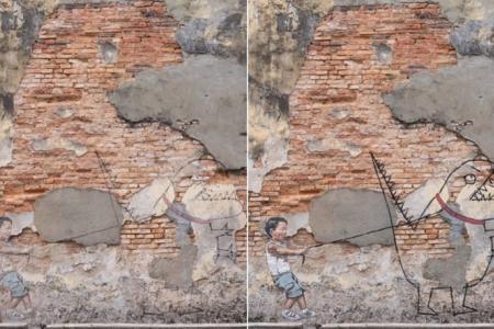 Penang murals restored by Lithuanian artist Ernest Zacharevic