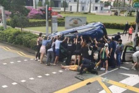 About a dozen people lifted car outside Parliament House to help accident victims