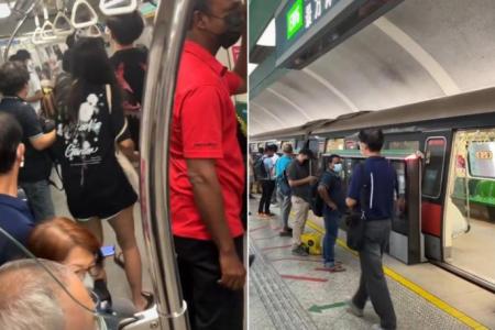 Commuters disembark at Kembangan after white smoke is seen in MRT train cabin