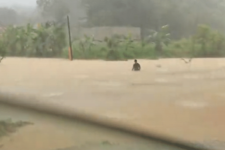 A father's love: M'sian braves chest-deep floodwater for baby supplies