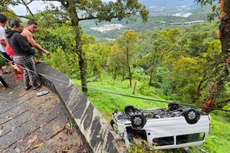 Residents use rocks to smash windows to rescue trapped Singapore tourists in Penang van crash