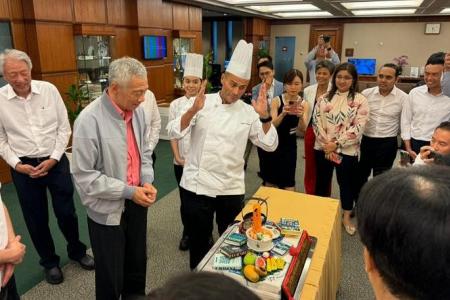 PM Lee presented with ‘mee siam’ cake on his last day of Parliament as prime minister
